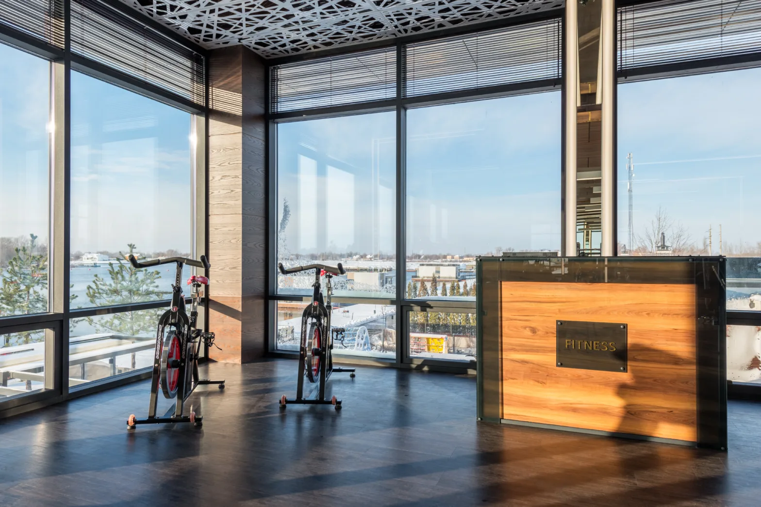 Fitness machines and reception desk in modern sports club.